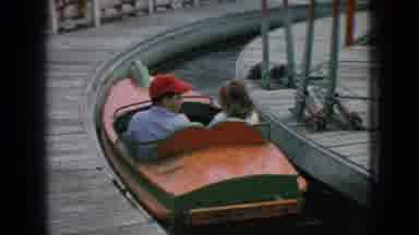 New Jersey USA (1966): A Boy And A Girl Riding A Boat Ride On A Theme Park