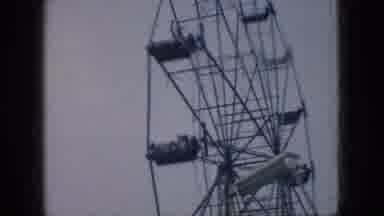 New Jersey USA (1966): Adult And Child Riding The Ferris Wheel While Waving And