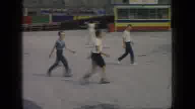 New Jersey USA (1966): Children Walking In A Playground And Three Men Sitting On A