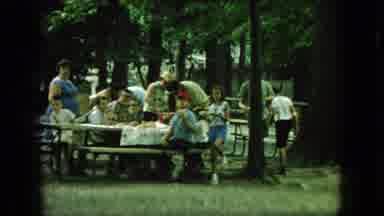 New Jersey USA (1966): A Ferris Wheel And A Group Of People Having A Picnic