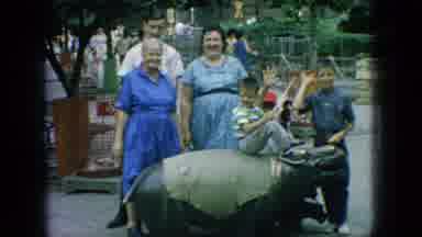 New Jersey USA-1966: Family At Zoo With Rhinoceros Statue And Wolves