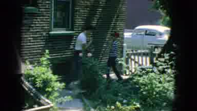 New Jersey USA (1966): A Reflection Of Orange Leaves In A Pond And Two Young Boys