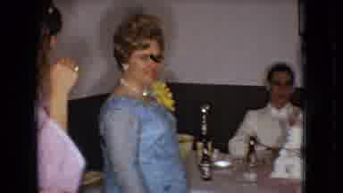 Ohio USA (1966): A Woman Talks To A Seated Man At A Table While Two Girls Watch