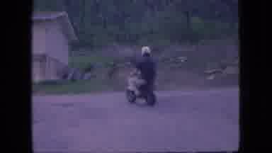 Ohio USA (1966): Man Riding Mini Bike Safely On Road Warm Day Activity