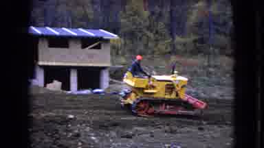 Ohio USA (1966): Man On Tractor Works In Dirt Field