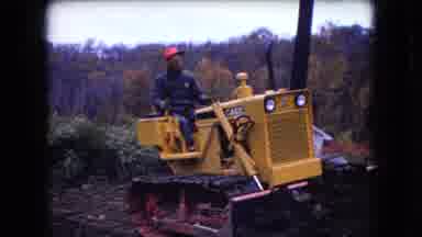 Ohio USA (1966): Laborer Clears Land With Small Bulldozer