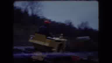 Ohio USA (1966): Father Teaching Son Leveling Dirt Field Using Yellow Tractor