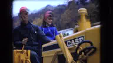 Ohio USA (1966): Man And Woman Using A Tractor To Mow The Land