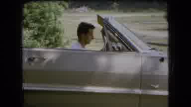 Ohio USA (1966): Man In Convertible Trying To Start The Car To Take A Trip