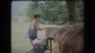 Ohio USA (1966): A Family Dressed In Bathing Suits Prepares For A Meal Around