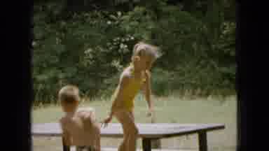 Ohio USA (1966): Women Grilling Hotdogs At A Park While Children Play On The