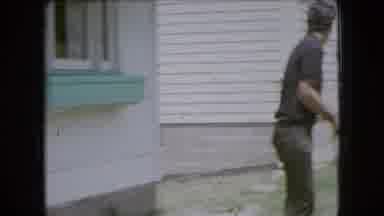 OHIO USA-1966: Family Playing With Water Hose in Backyard
