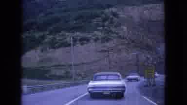 Ohio USA (1966): Cars Approaching Tunnel On Curved Road While Surrounded By Open