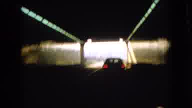 Ohio USA (1966): A Car Driving Slowly Out Of A Tunnel