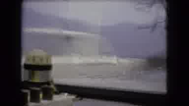 Ohio USA (1966): Person Driving Vehicle With Windshield Wipers On In A Cloudy Area