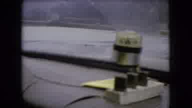 Ohio USA (1966): Car Drives Across Bridge In Rain