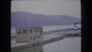 Ohio USA (1966): Car Behind Fence And Industrial Dock
