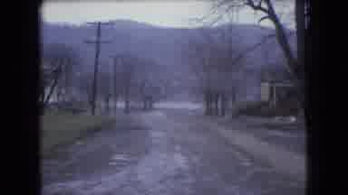 Ohio USA (1966): Cars Traveling Down A Hill On Icy Roads