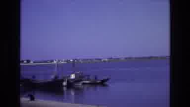 Portugal (1972): A Small Boat Pulling Into A Dock