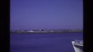 PORTUGAL-1972: View Over Ocean Showing Coastline And Bow Of Seafaring Vessel
