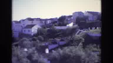 PORTUGAL-1972: A Scenic Mountainside Drive Through White Houses and Lush Greenery