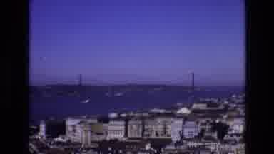 Portugal (1972): Bridge Over Large Body Of Water Leading Into City