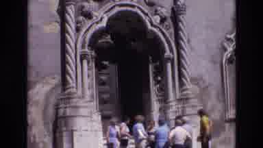 PORTUGAL-1972: Tourists Standing Near A Massive Ornate Doorway