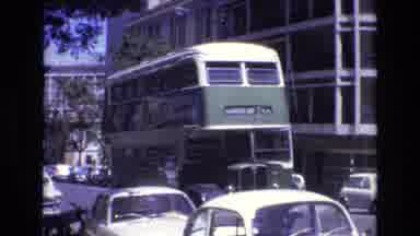 PORTUGAL-1972: Double-Decker Bus with Nova Binaca Ad Navigating City Street