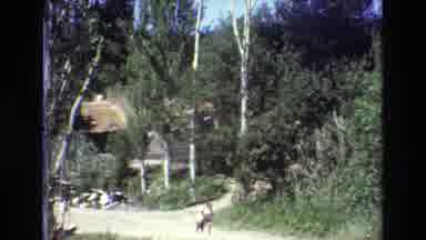 PORTUGAL-1972: Child On A Road Switching To Old Church With People
