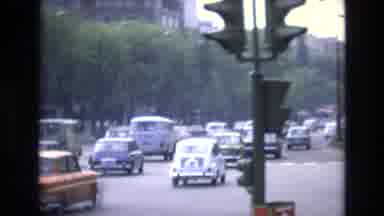 Spain (1972): A Busy Day With Rushing Of Cars At A Commuting Street That Have The