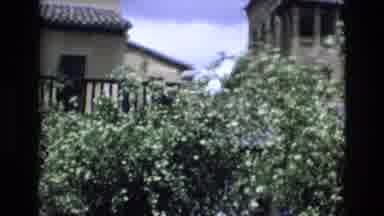 Spain (1972): Person In Garden In Front Of Building