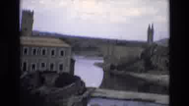 Spain (1972): Shots Of A Tourist Area With A Building Bridge River Bus And More