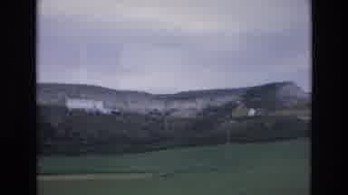 Spain (1972): A Large Tornado Moving Partially Hidden By Low Hills