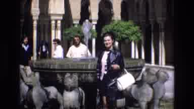 Spain (1972): Multiple People Particularly A Women Posing Outside