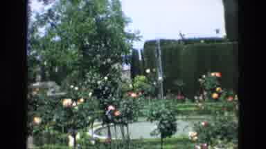 Spain (1972): A Water Fountain In A Pool Is Surrounded By Flowering Plants