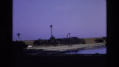 Spain (1972): Panning Footage Of Pool In Front Of Archway Near Open Field During