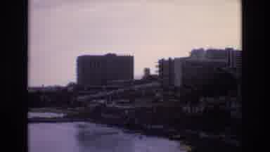 Spain (1972): City Next To Ocean Waves Large Buildings With Rocks In The Sea Beach