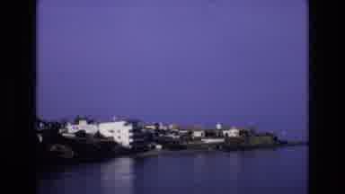 Spain (1972): Camera Overlooking A Lake Shore Full Of Condos