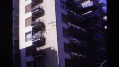 Spain (1972): Observing A Multi-Story Building With Balconies In A City On A Sunny