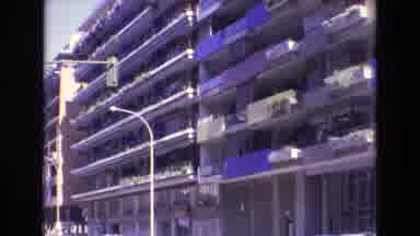 Spain (1972): Downtown Parking Garage With People Scattered Above Living As The