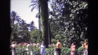 Spain (1972): Old Video People Walking Around On Sidewalk And Admiring Famous