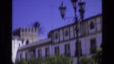 Spain (1972): Large Grey Unique Building With A Watchtower Near A Busy Road