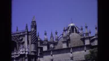 Spain (1972): A Gothic Architecture Church With Many Spires Has A Road Running