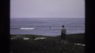 Central Coast California USA (1973): Man Holding Something While Walking Toward