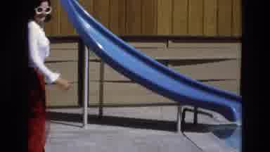 Central Coast California USA (1973): Woman In White Shirt And Sunglasses Sitting