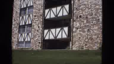 Colorado USA (1973): A Multi-Storied Building Has A Brick Face And A Grass-Covered