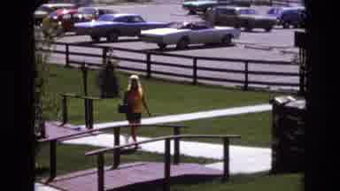 Colorado USA (1973): Walking Woman At A Park About To Get Onto A Small Bridge