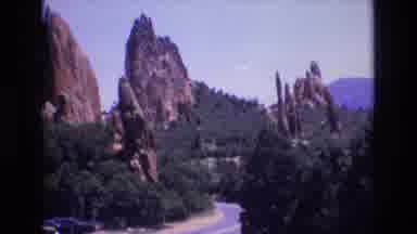 Colorado USA (1973): Trees And Mountains Surround Twisting Road In The Morning