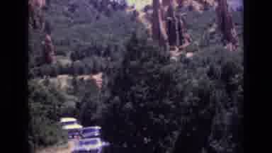 Colorado USA (1973): Home Video Of Cars Driving Through A Forest With Rock