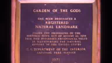 Colorado USA (1973): A Brass Plaque Precedes A Rock Formation Underneath A Clear